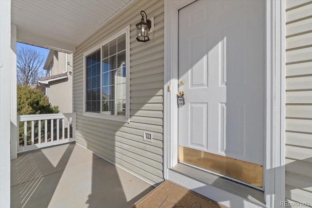 doorway to property featuring a porch