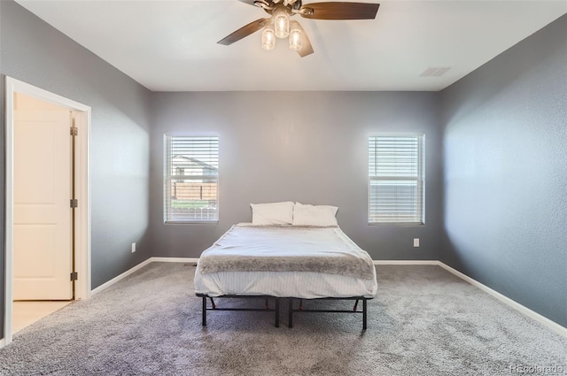 bedroom with ceiling fan and carpet flooring