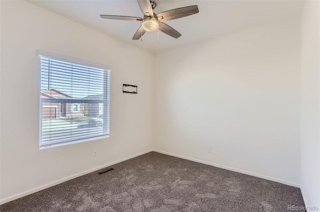 spare room with ceiling fan and carpet flooring