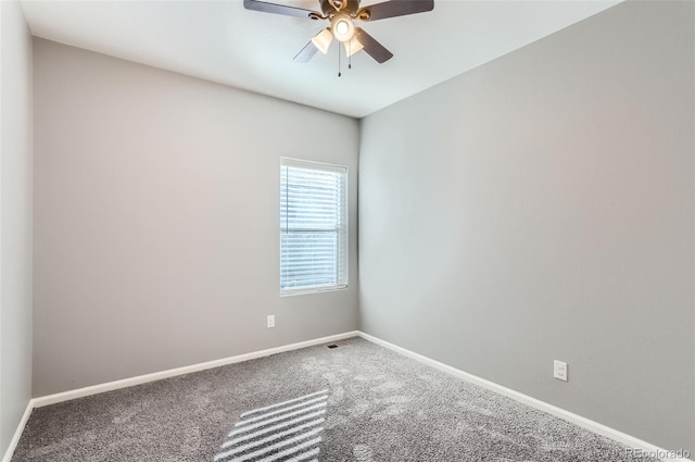 carpeted empty room with ceiling fan