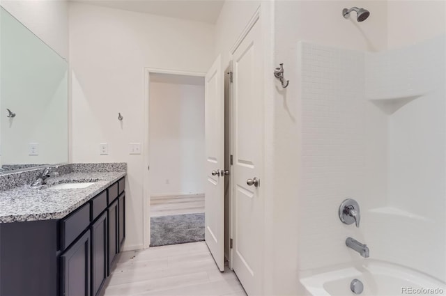 bathroom with shower / washtub combination and vanity