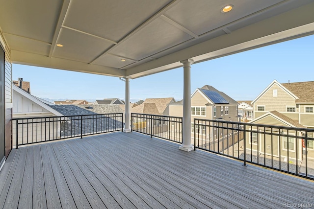 wooden terrace featuring a residential view