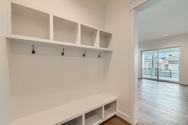 mudroom featuring recessed lighting, baseboards, and wood finished floors