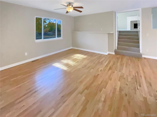 unfurnished living room with light hardwood / wood-style floors and ceiling fan