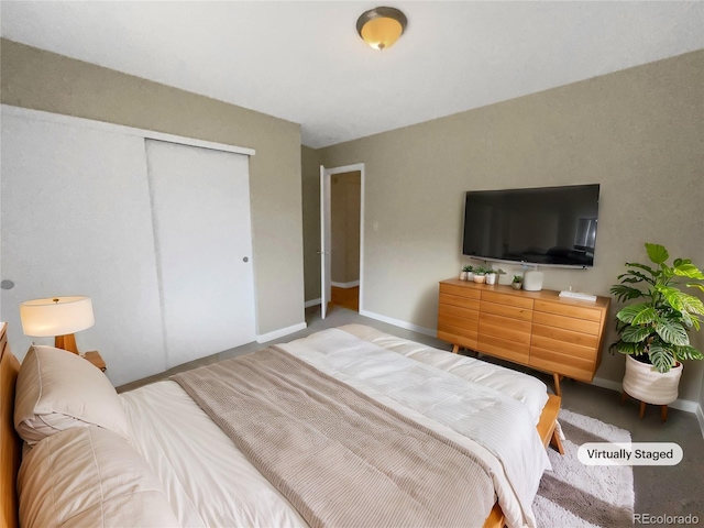 bedroom featuring a closet and carpet