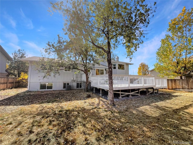 back of property featuring a wooden deck and central AC unit