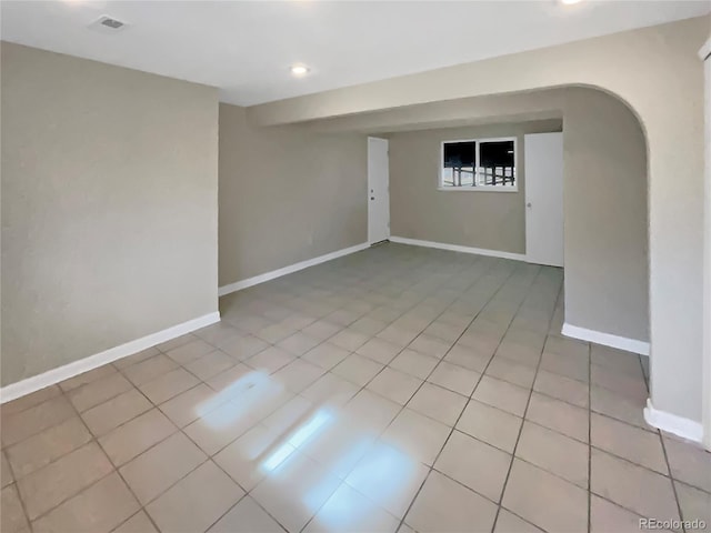 unfurnished room with light tile patterned floors