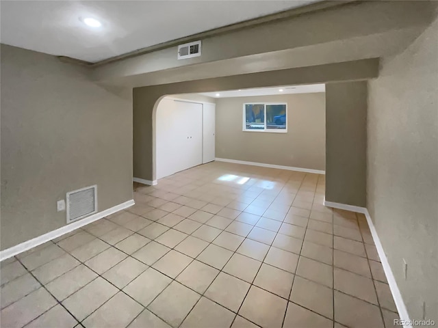 empty room with light tile patterned flooring