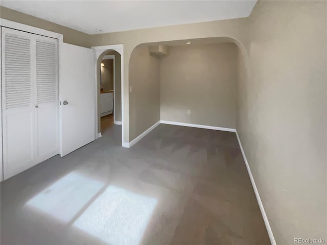 unfurnished bedroom with carpet and a closet