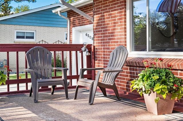 6506 Lee St, Arvada, CO 80004 - view of patio with a garage