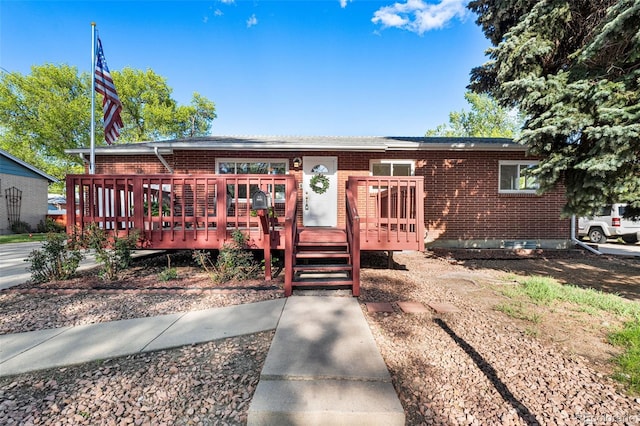6506 Lee St, Arvada, CO 80004 - ranch-style house featuring brick siding and a deck
