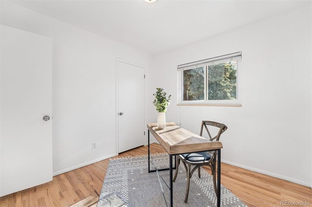6506 Lee St, Arvada, CO 80004 - home office featuring wood finished floors and baseboards