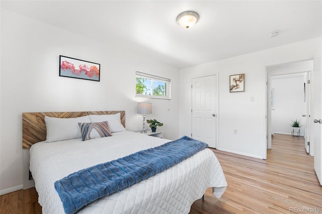 6506 Lee St, Arvada, CO 80004 - bedroom with light wood-style floors and baseboards