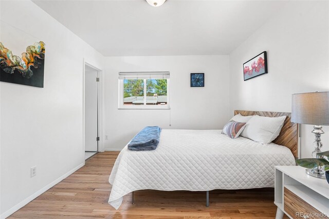 6506 Lee St, Arvada, CO 80004 - bedroom with baseboards and light wood-type flooring