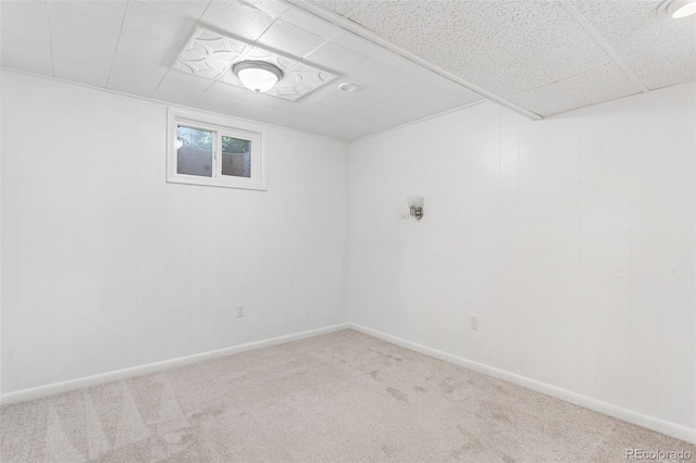 6506 Lee St, Arvada, CO 80004 - basement featuring carpet floors, a paneled ceiling, and baseboards