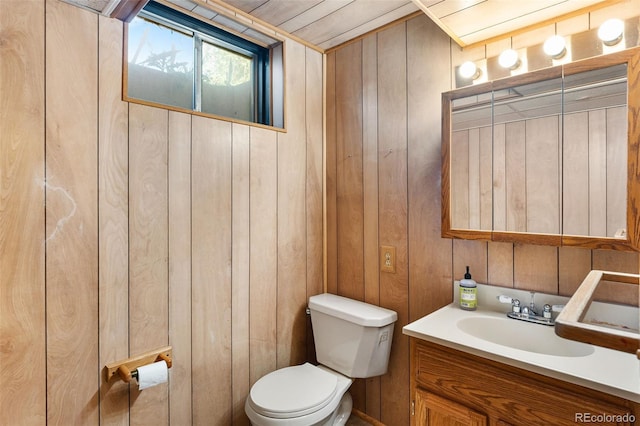 6506 Lee St, Arvada, CO 80004 - half bath with toilet, wood walls, and vanity
