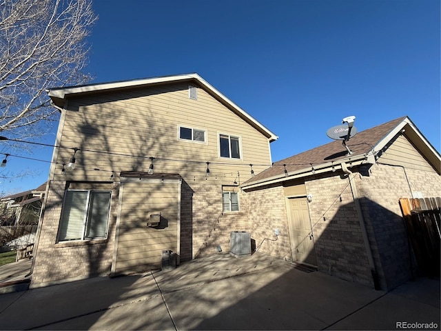 rear view of property featuring a patio