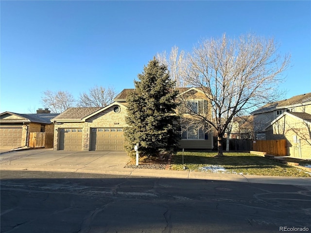 obstructed view of property featuring a garage