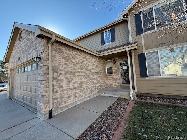 entrance to property featuring a garage