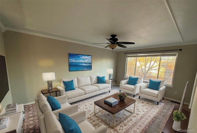 13031 Dexter St, Thornton, CO 80241 - living room featuring baseboards, a ceiling fan, and ornamental molding