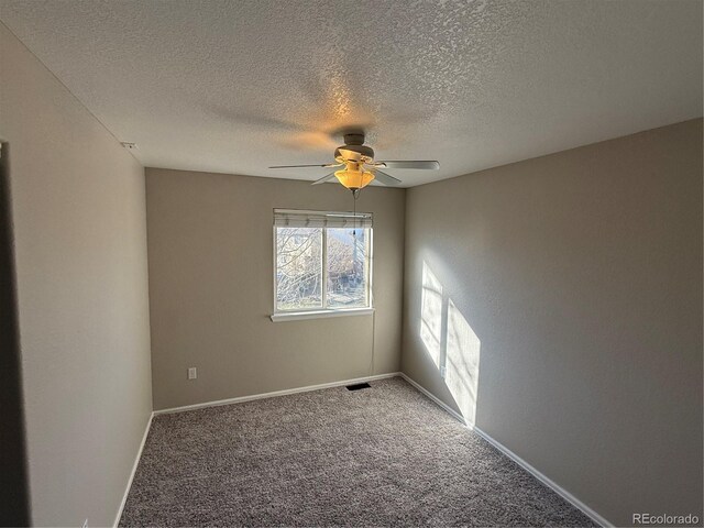 13031 Dexter St, Thornton, CO 80241 - spare room with a ceiling fan, a textured ceiling, carpet floors, and baseboards