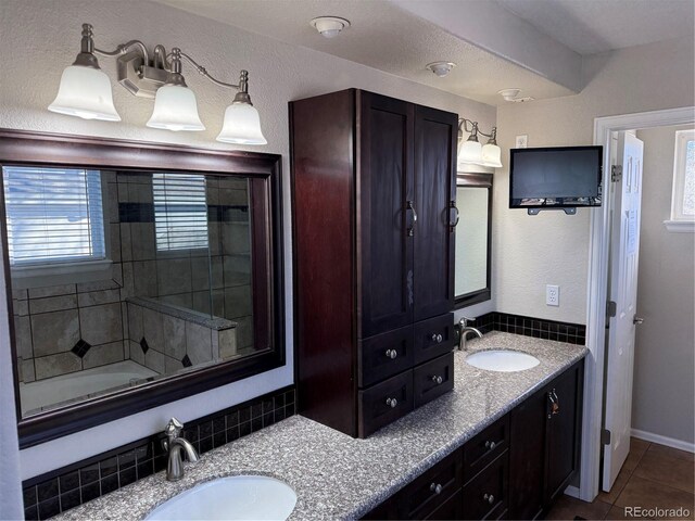 13031 Dexter St, Thornton, CO 80241 - full bath featuring plenty of natural light, double vanity, and tile patterned floors