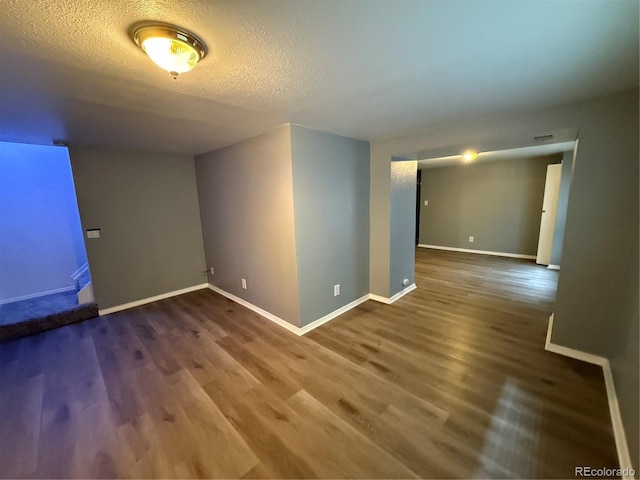 13031 Dexter St, Thornton, CO 80241 - spare room featuring wood finished floors, a textured ceiling, and baseboards