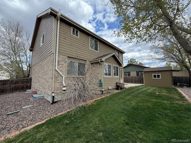 13031 Dexter St, Thornton, CO 80241 - rear view of property featuring an outbuilding and brick siding