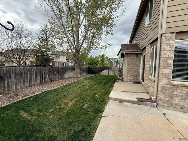 13031 Dexter St, Thornton, CO 80241 - view of yard featuring a residential view and a patio area