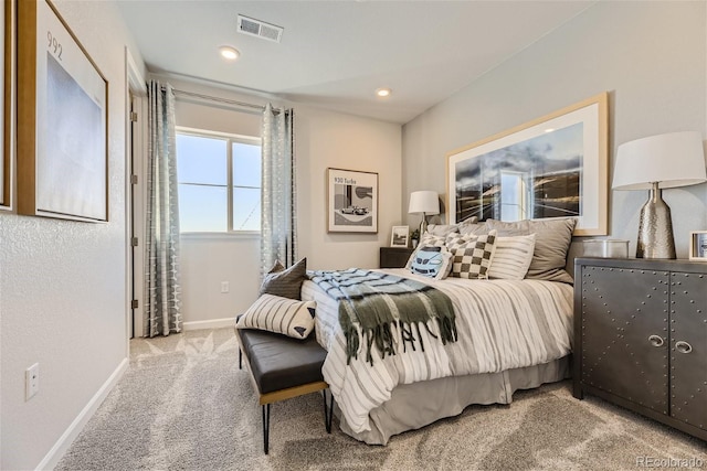 carpeted bedroom with visible vents, recessed lighting, and baseboards