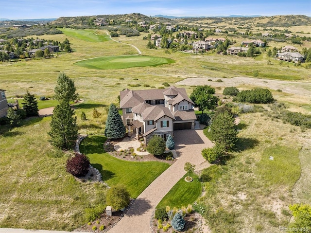 drone / aerial view featuring view of golf course and a mountain view