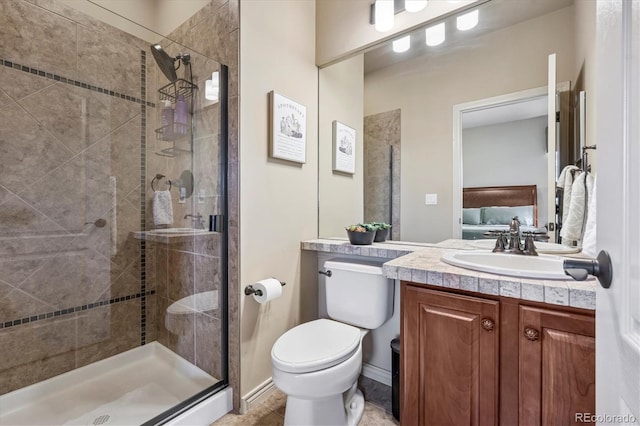 full bath featuring vanity, a shower stall, and toilet