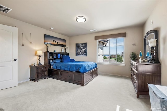 bedroom with baseboards, light colored carpet, and visible vents