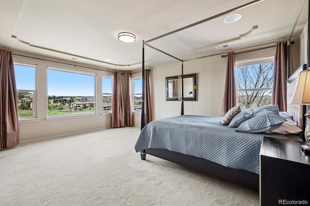 bedroom with visible vents and carpet floors