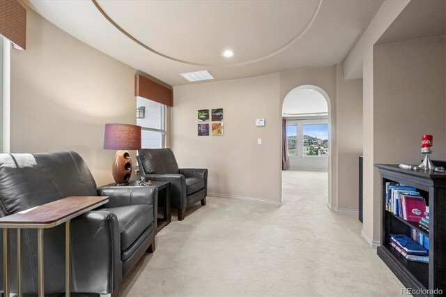 living room with light colored carpet, visible vents, baseboards, and recessed lighting