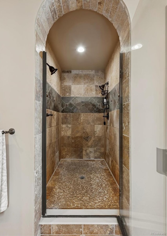 full bathroom with a shower stall and recessed lighting