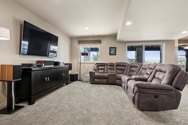 living area with carpet and recessed lighting