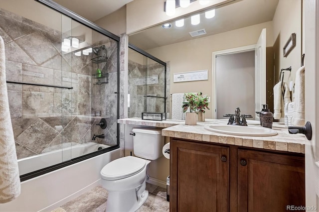 full bathroom with enclosed tub / shower combo, toilet, vanity, and visible vents