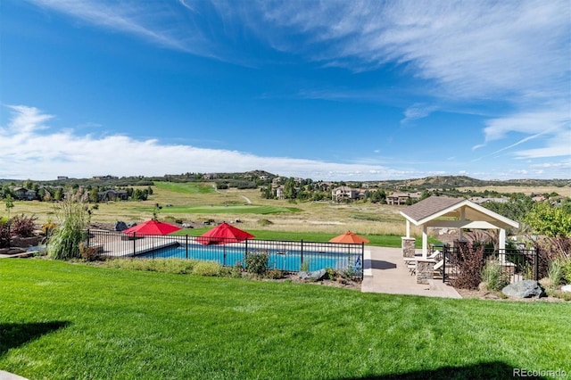 view of pool with a patio, fence, a lawn, a gazebo, and a fenced in pool
