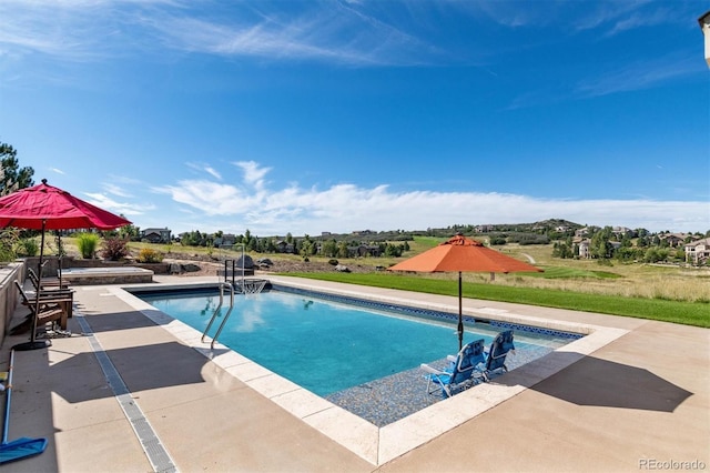 pool with a patio area