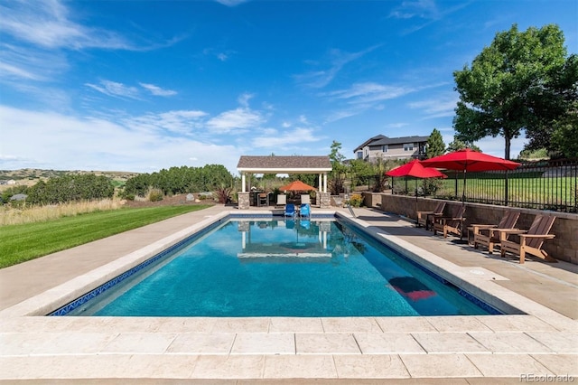 view of swimming pool with a gazebo, a patio area, a fenced in pool, and fence