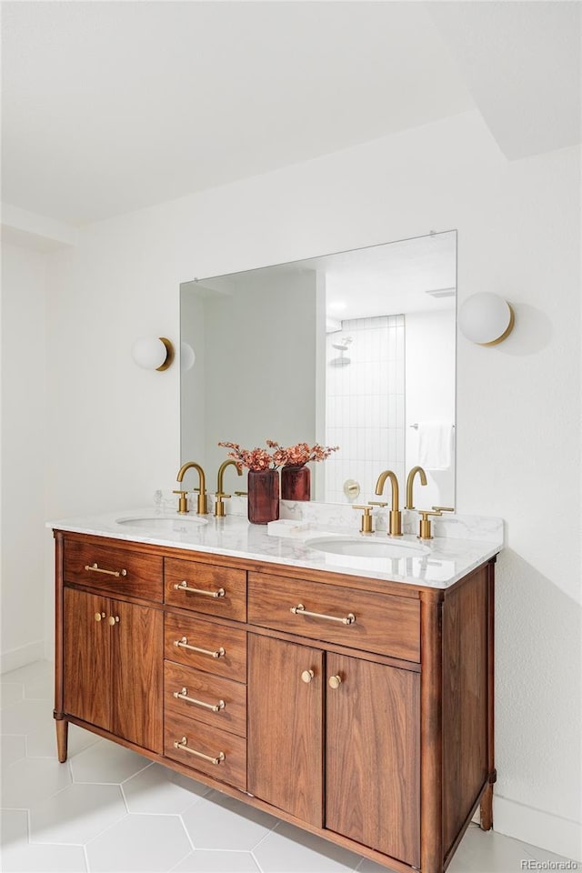 bathroom with tile patterned floors and vanity