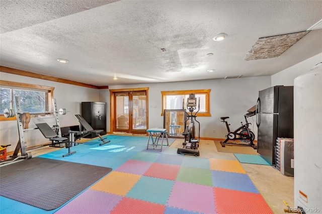 workout area featuring a textured ceiling