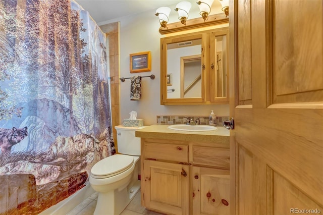 bathroom featuring vanity, tile patterned flooring, curtained shower, and toilet