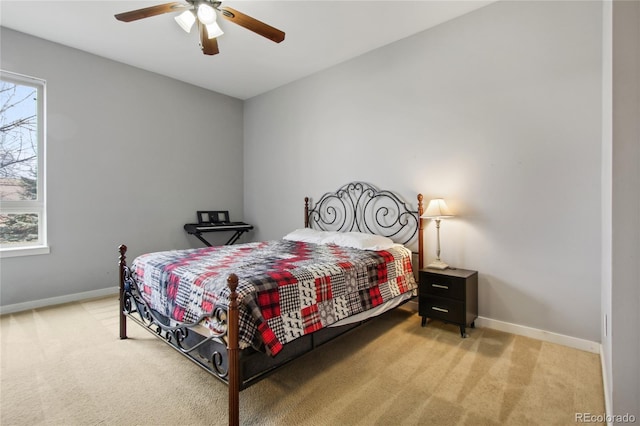 bedroom with multiple windows, carpet flooring, and baseboards