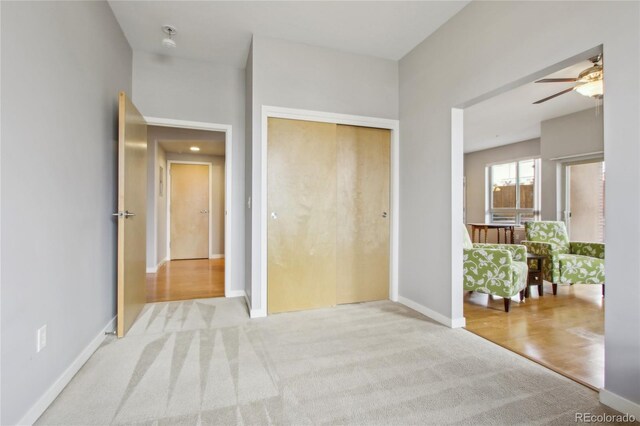 unfurnished bedroom with a closet, carpet flooring, and baseboards