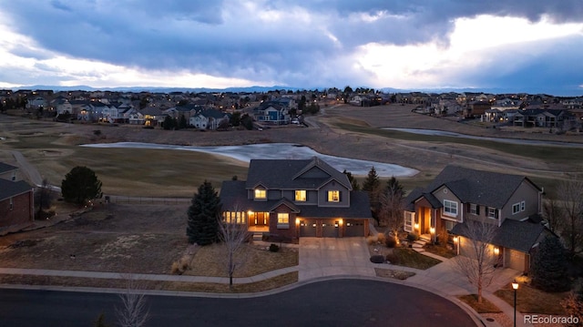 view of front facade featuring decorative driveway and a residential view