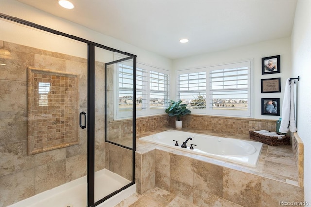 full bath featuring a stall shower, recessed lighting, and a bath