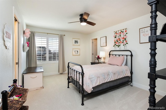 bedroom featuring light carpet, ceiling fan, and baseboards