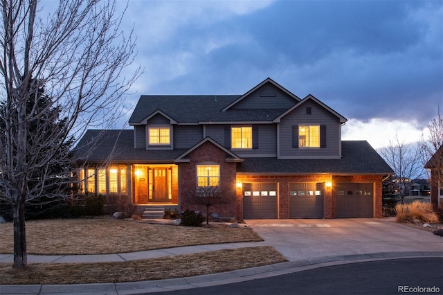 view of front of home with an attached garage, roof with shingles, concrete driveway, and brick siding